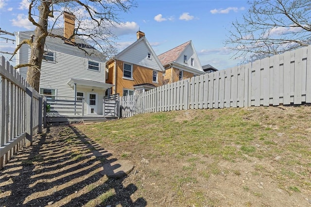 view of yard with a fenced backyard