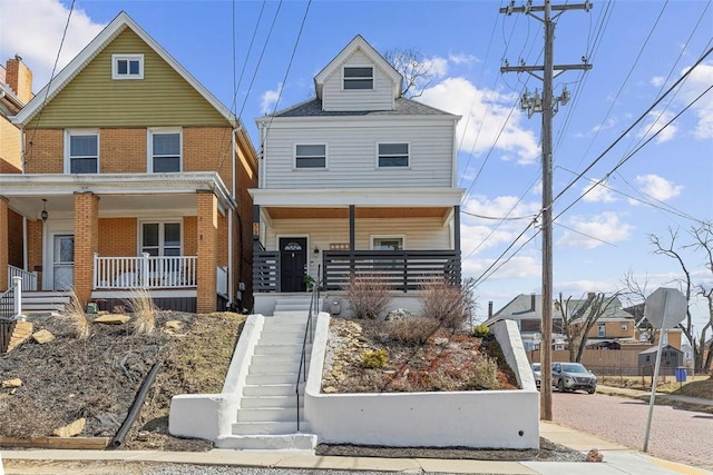 view of front facade with covered porch and stairs