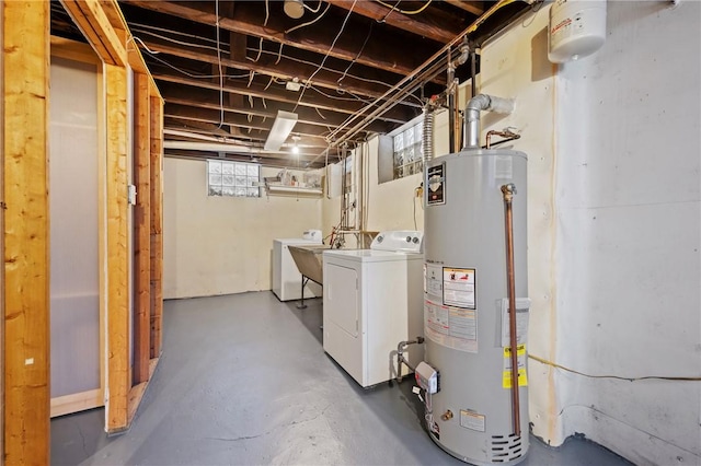 below grade area with washer / dryer, gas water heater, and a sink