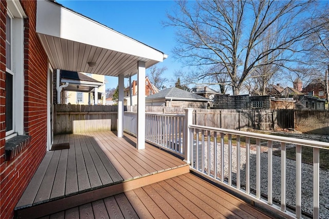 deck with a fenced backyard