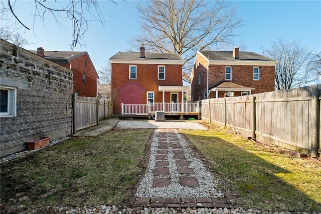 view of yard featuring a wooden deck and a fenced backyard