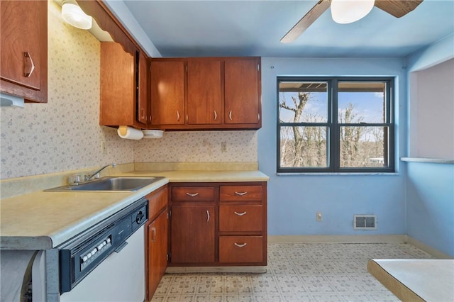 kitchen with light floors, visible vents, a sink, light countertops, and dishwasher