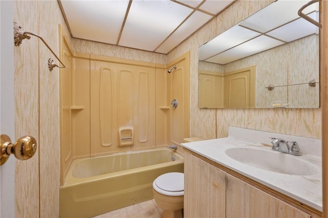 full bath with tile patterned floors, toilet, shower / bathtub combination, wallpapered walls, and vanity