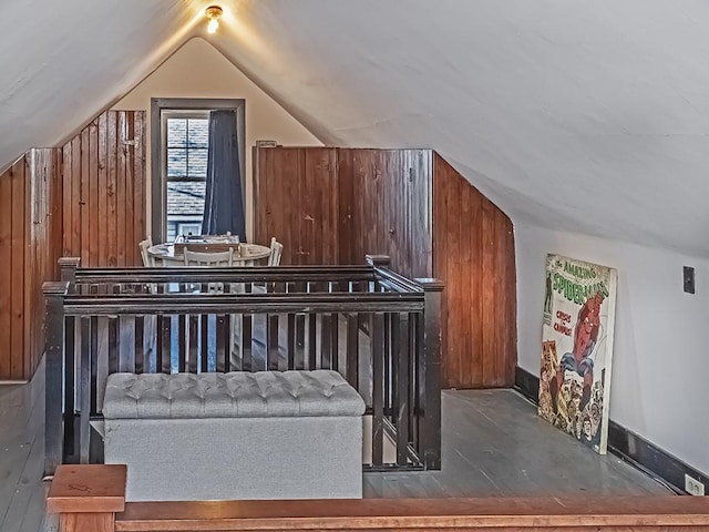 bonus room with baseboards and vaulted ceiling