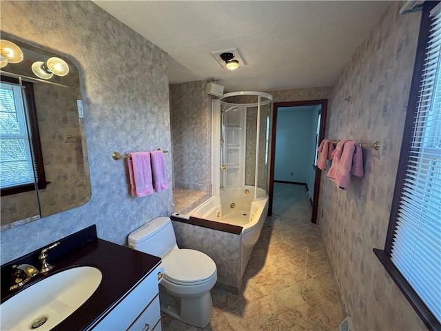 bathroom featuring vanity, wallpapered walls, a whirlpool tub, an enclosed shower, and toilet