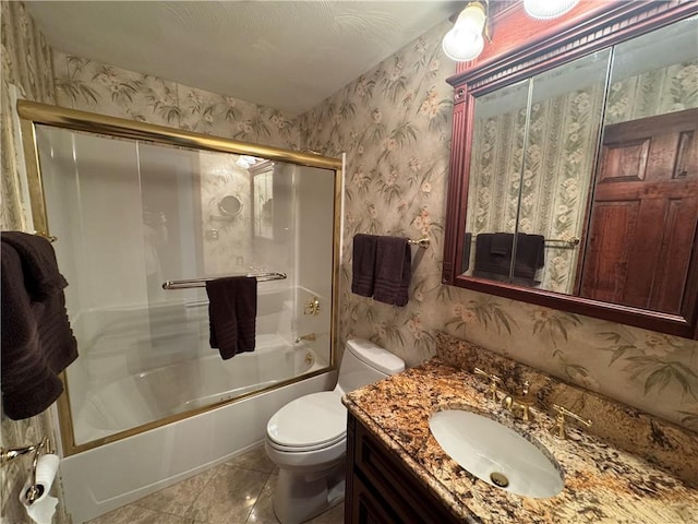 full bath with wallpapered walls, toilet, vanity, and combined bath / shower with glass door