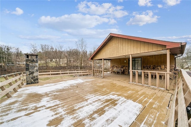 view of snow covered deck