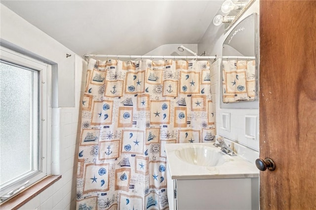 full bath with vanity and a shower with curtain