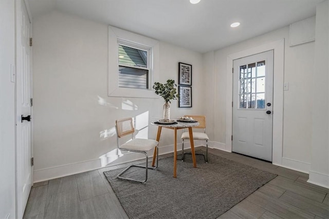 foyer with recessed lighting, baseboards, and wood tiled floor