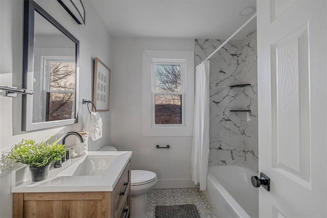 bathroom featuring shower / tub combo, plenty of natural light, toilet, and vanity