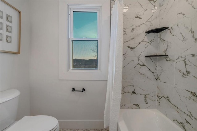 bathroom featuring shower / bath combination with curtain, toilet, and baseboards