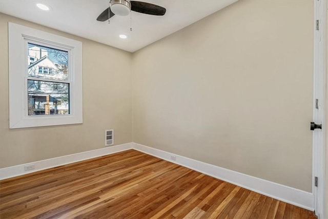 spare room featuring recessed lighting, visible vents, light wood-style flooring, and baseboards