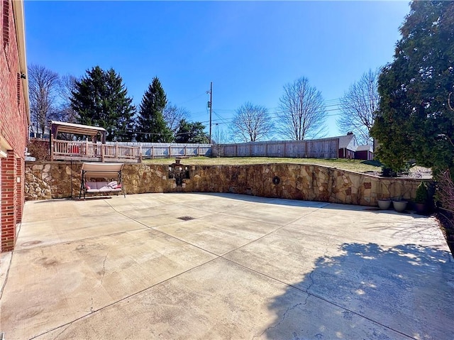 view of patio / terrace featuring fence