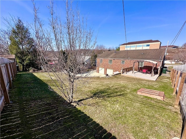 view of yard with a patio and a fenced backyard