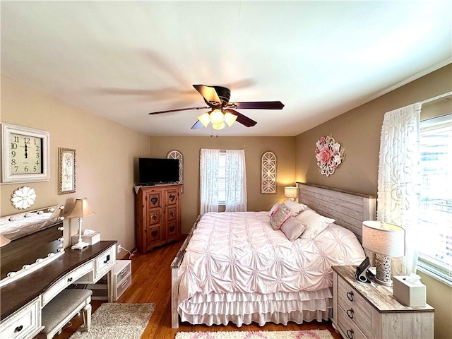 bedroom featuring ceiling fan and wood finished floors