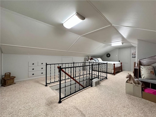 bonus room with vaulted ceiling and carpet flooring