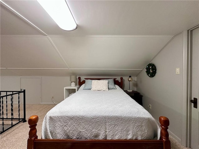 bedroom with carpet flooring and vaulted ceiling