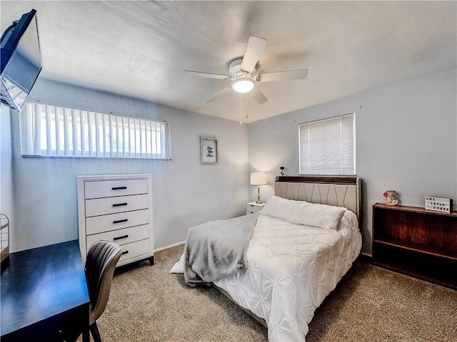 bedroom with carpet and a ceiling fan