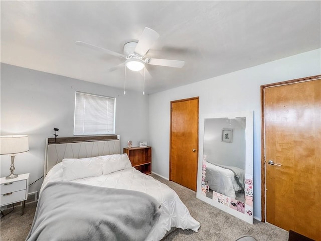 bedroom with baseboards, a ceiling fan, and carpet flooring