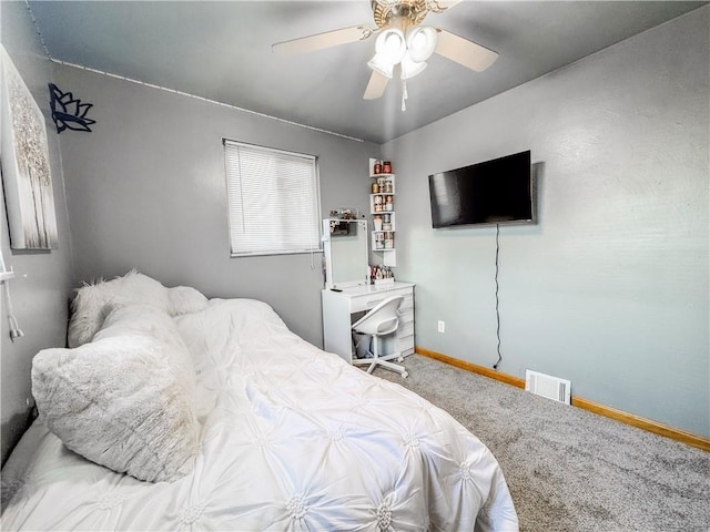 bedroom featuring ceiling fan, carpet, visible vents, and baseboards