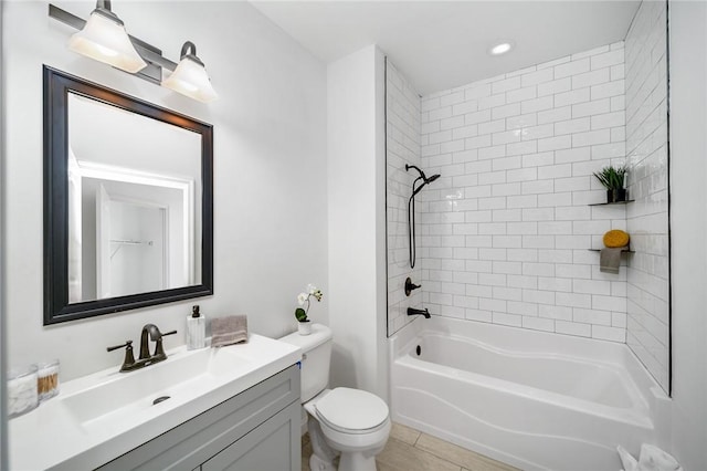 full bath featuring recessed lighting, toilet, vanity, and shower / tub combination