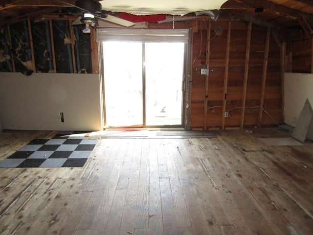 interior space featuring hardwood / wood-style floors and lofted ceiling