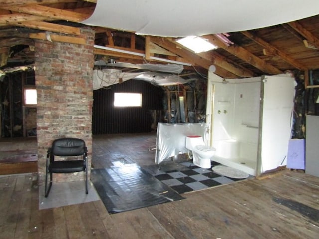 basement featuring hardwood / wood-style floors