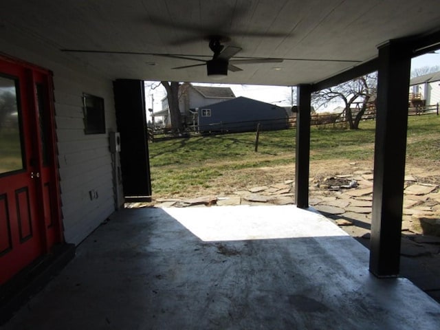 view of patio with ceiling fan and fence