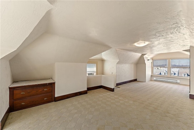 bonus room featuring baseboards, vaulted ceiling, a textured ceiling, a baseboard heating unit, and carpet flooring