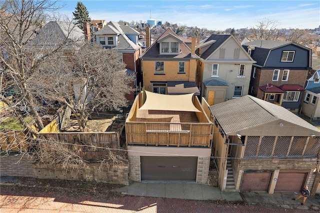 view of front of home featuring a residential view and an attached garage