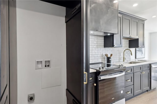 kitchen featuring light countertops, dishwasher, a sink, gray cabinetry, and electric range oven