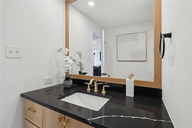 bathroom with recessed lighting and vanity