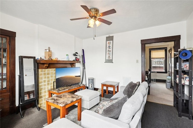 living room featuring ceiling fan and carpet