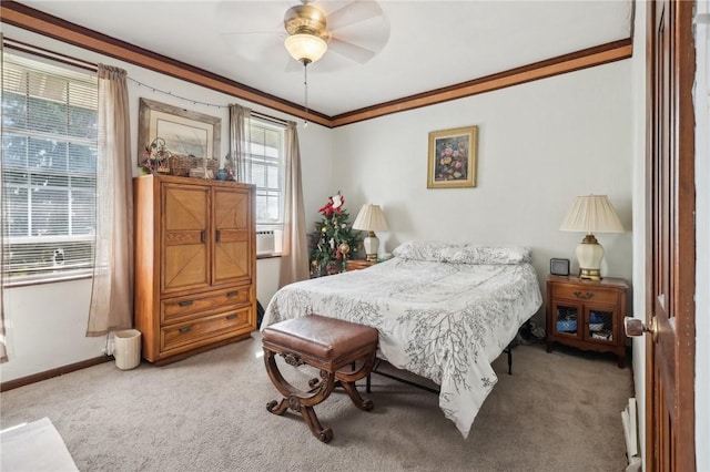 bedroom with carpet flooring, ceiling fan, crown molding, and baseboards