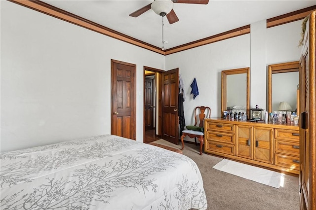 bedroom with a ceiling fan, carpet, and ornamental molding