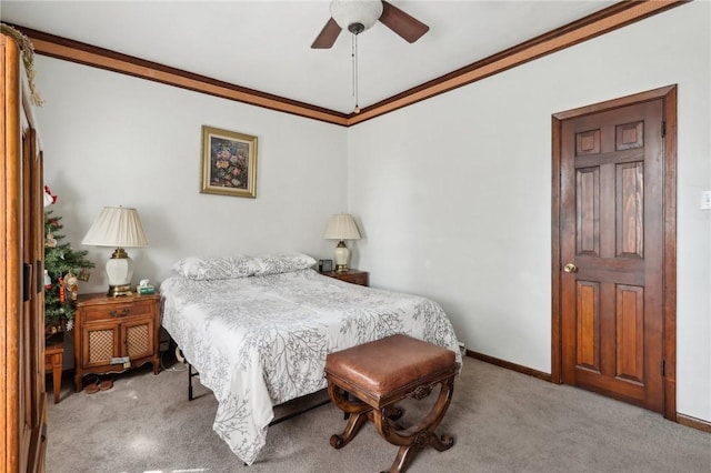 bedroom featuring ceiling fan, baseboards, carpet, and ornamental molding