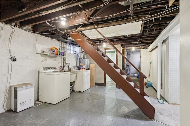 unfinished basement with stairway and washer and dryer