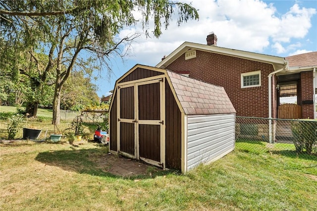 view of shed featuring fence