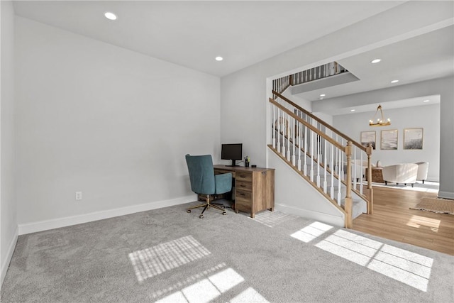 office space with recessed lighting, baseboards, a notable chandelier, and carpet