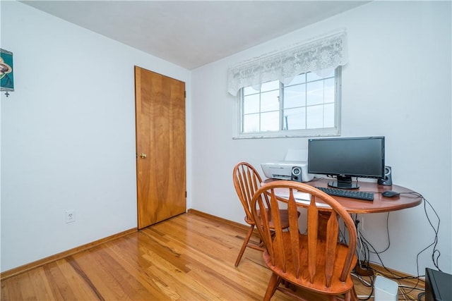 office featuring light wood finished floors and baseboards