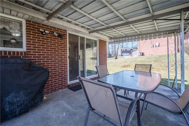 view of patio with grilling area and outdoor dining space