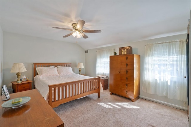 bedroom with visible vents, carpet, ceiling fan, and vaulted ceiling