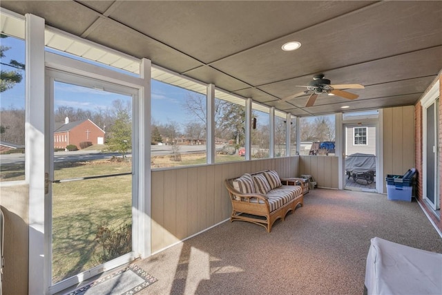 sunroom featuring plenty of natural light and ceiling fan