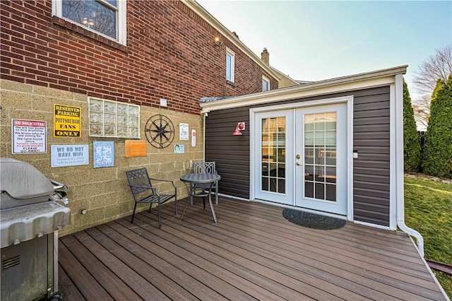 wooden deck featuring french doors