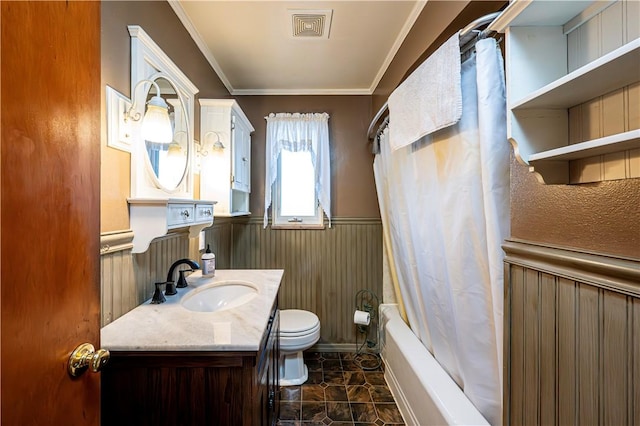 bathroom with visible vents, shower / bath combo with shower curtain, toilet, a wainscoted wall, and crown molding