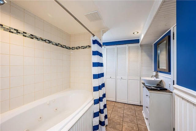 full bath with visible vents, vanity, and tile patterned flooring