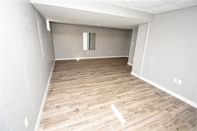 empty room with wood finished floors and baseboards