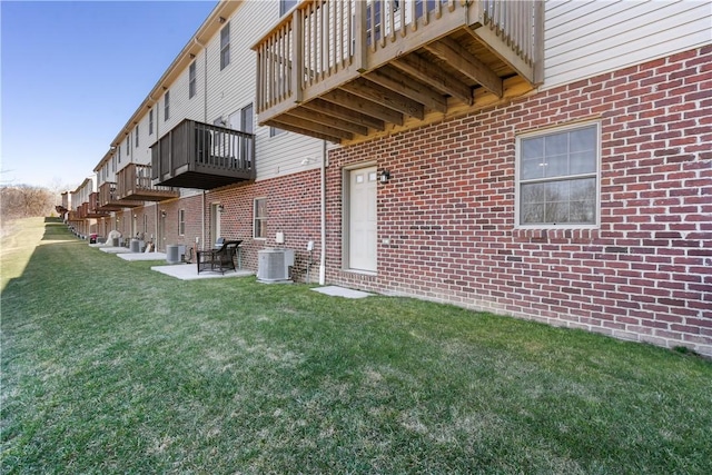 view of yard featuring cooling unit and a patio