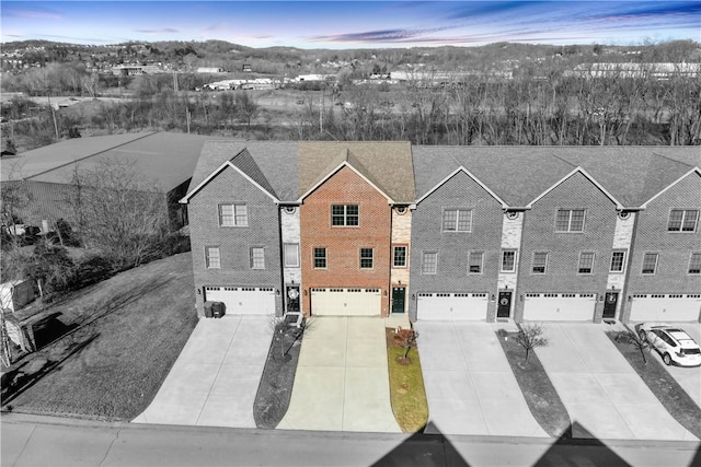 birds eye view of property with a residential view