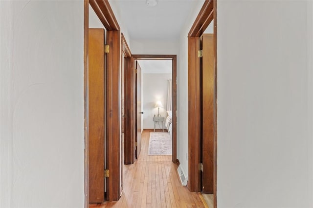 hallway with light wood finished floors